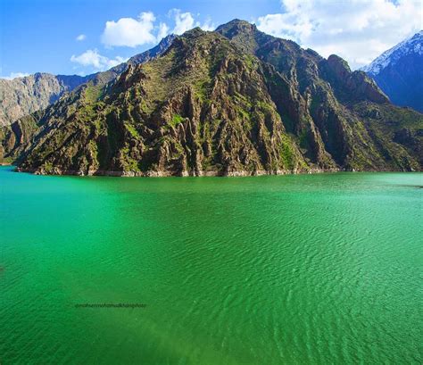 an aerial view of the water and mountains