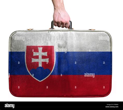 Tourist hand holding vintage leather travel bag with flag of Slovakia Stock Photo - Alamy