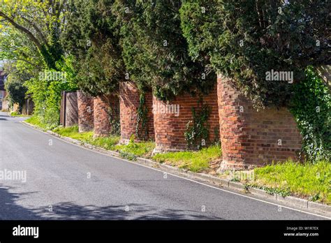 Crinkle-crankle brick garden wall outside the former home of Dennis ...