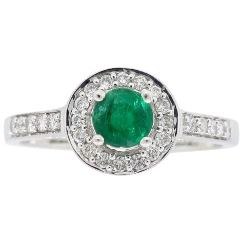 Emerald and Diamond Halo Ring at 1stDibs | emerald halo ring