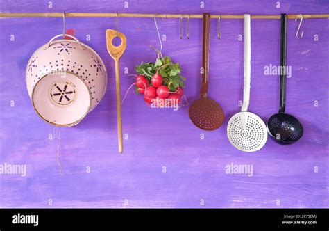 hanging vintage kitchen utensils and a bunch of radish, cooking concept,copy space Stock Photo ...