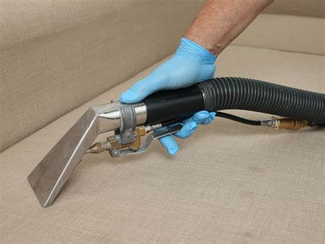 Steam cleaning a sofa as part of Fantastic Cleaners' upholstery ...