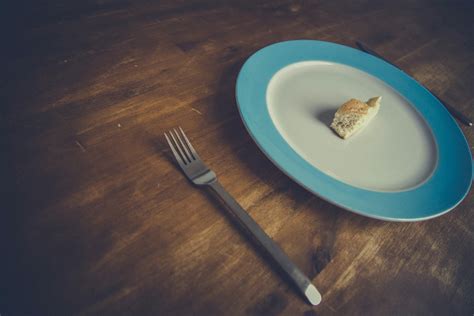 Dieting Concept Plate With A Piece of Bread and A Folk - High Quality Free Stock Images