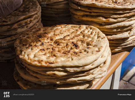 Stacks of fresh baked Arabic bread stock photo - OFFSET