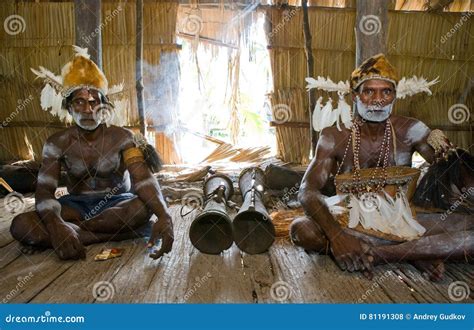 Men Asmat Tribe are Sitting at Home and Play on the Drum. Editorial Stock Photo - Image of ...