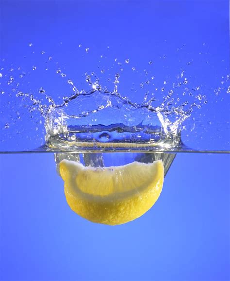 A Lemon Slice Splashing Into Water Royalty Free Stock Images - Image ...