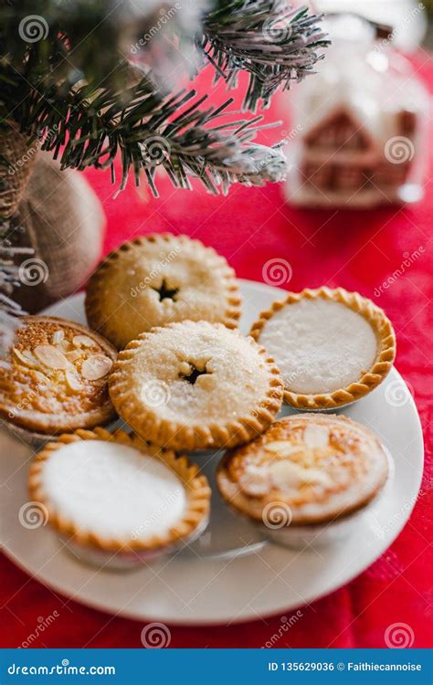 Mince Pies on Christmas Table Setting with Decorations and Tree Stock ...