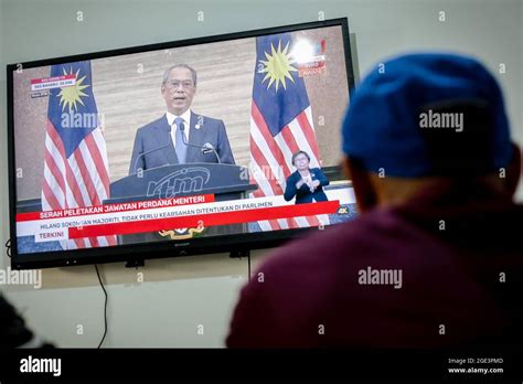 Prime Minister Muhyiddin Yassin's speech on a TV screen in Kuala Lumpur.Malaysian Prime Minister ...