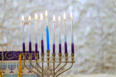 Hanukkiah Menorah candle is lit during traditional celebration of ...