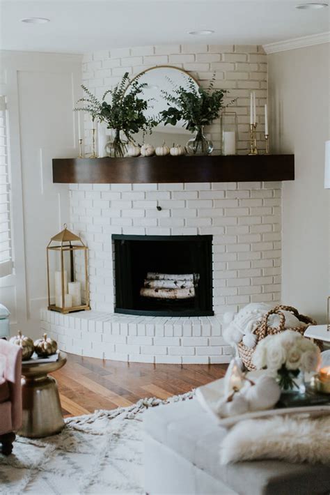 A Curved Fireplace Decorate in Brass and Nature — Homebnc