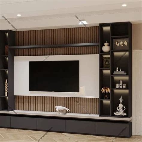 a living room with a large television on the wall and shelves in front of it