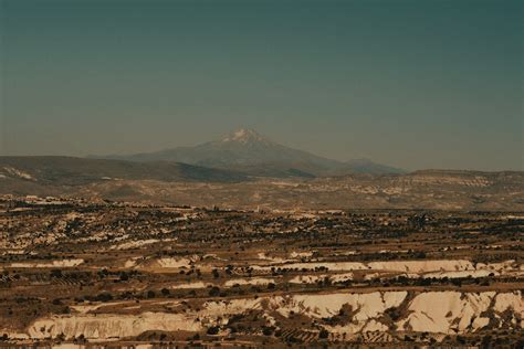 Arid Landscape and Mountain on Horizon · Free Stock Photo