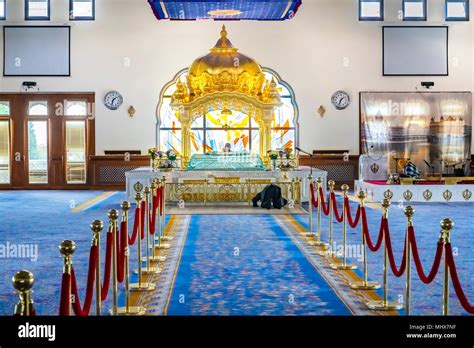 Worshiper and Manji Sahib inside Guru Nanak Darbar Gurdwara, the magnificent sikh temple ...