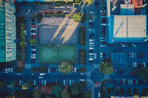 Premium Photo | Football field and tennis court in a residential area ...