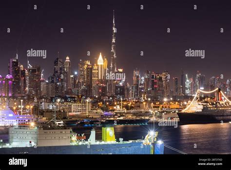 The Dubai skyline at night Stock Photo - Alamy