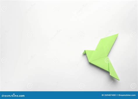 Beautiful Light Green Origami Bird on White Background, Top View. Space for Text Stock Photo ...