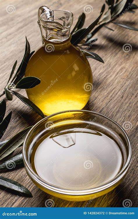 Olive Oil and Leaves on a Wooden Table Stock Photo - Image of organic, slate: 142824372