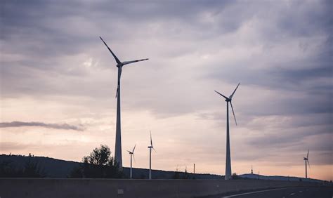 Premium Photo | Wind turbines farm renewable energy