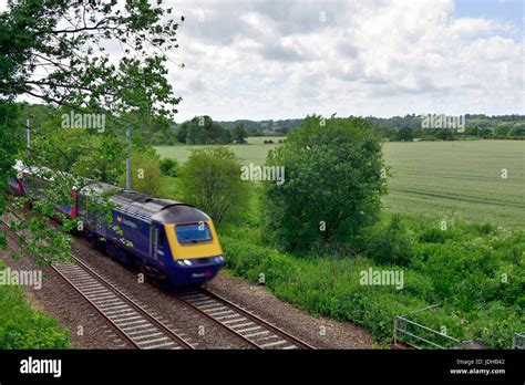 Train speeding through Berkshire countryside Stock Photo - Alamy