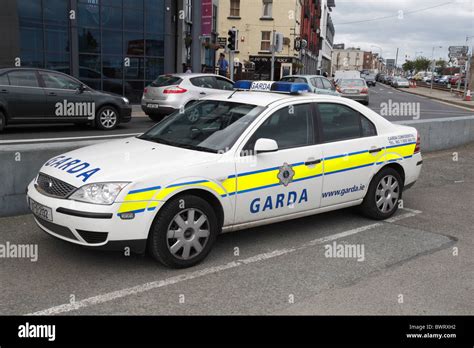 An Irish Garda (Police) car parked beside the coastal road in Wexford Town, Co. Wexford, Ireland ...