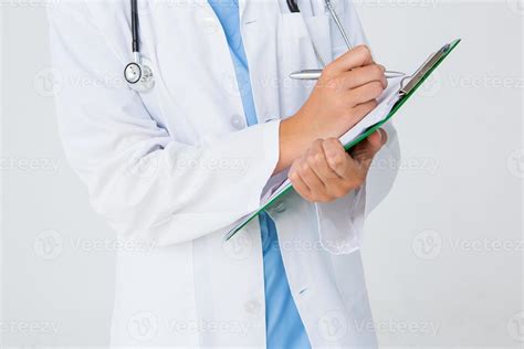 Doctor writing on clipboard 987693 Stock Photo at Vecteezy