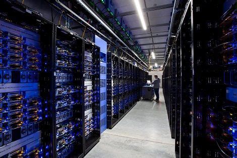 rows of servers in a data center with blue lights