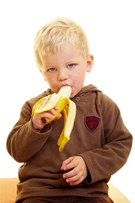 Child eats banana stock image. Image of infant, bite - 10454227