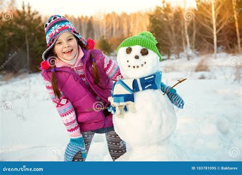 Happy Kid Playing with Snowman Stock Image - Image of child, february ...