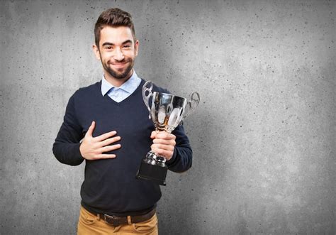 Free Photo | Proud young man showing his award