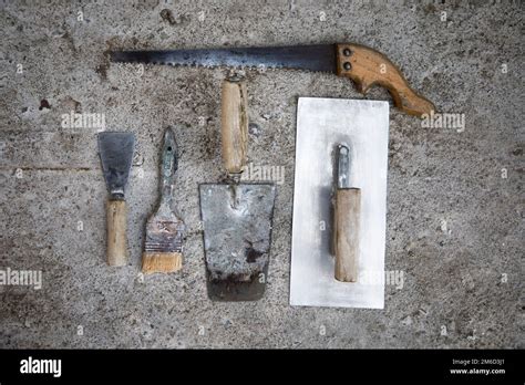 Old masonry tools, Construction masonry cement mortar tools Stock Photo - Alamy