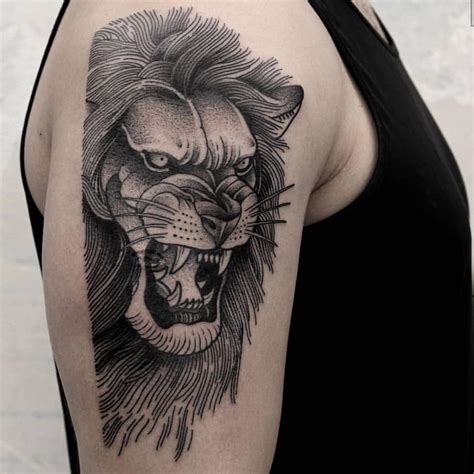 Angry lion tattoo on the right arm - Tattoogrid.net