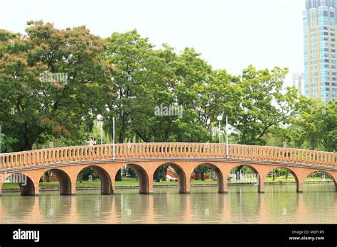 Beautiful orange cement bridge in Chatuchak public park Stock Photo - Alamy