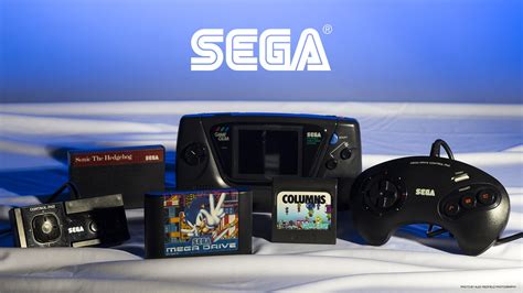 Black Sega console with controller and game cartridges, Sega, retro ...