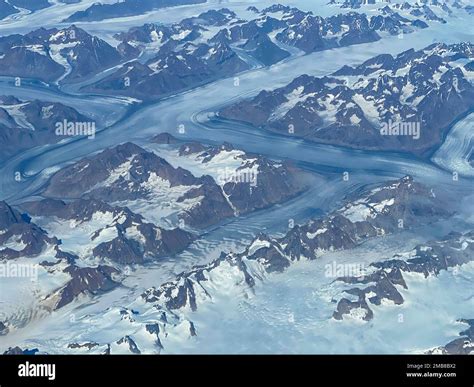 Aerial view of western Greenland Ice Sheet or Inland Ice as it covers ...