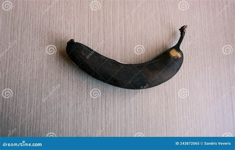 Photo of an Old Spoiled Banana. Black Rotten Banana Peel. Stock Image ...