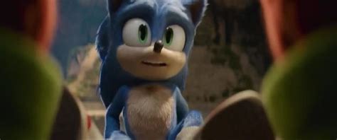 sonic the hedgehog is looking at something in front of him