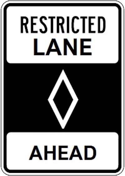 Restricted Lane Ahead Sign (Meaning, Color, Shape, What To Do)