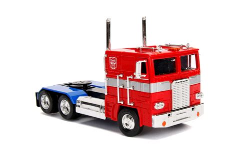 Jada Toys Transformers G1 Optimus Prime and Transformers 2007 Optimus ...