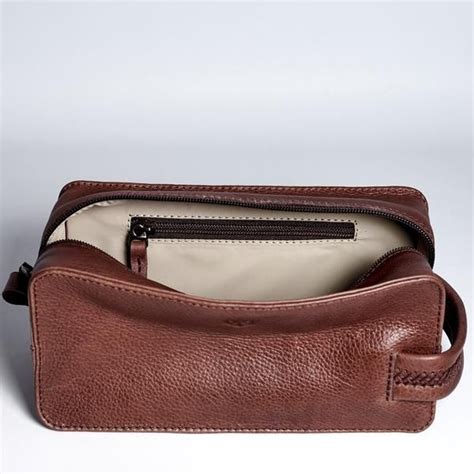 Beautifully designed minimal brown leather dopp kit, great functionality for the modern man ...