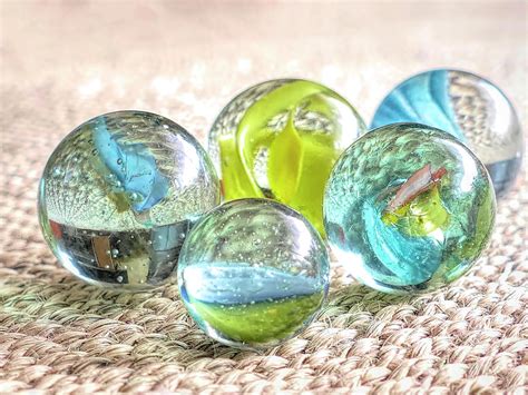 Five Glass Marbles Photograph by Elisabeth Lucas