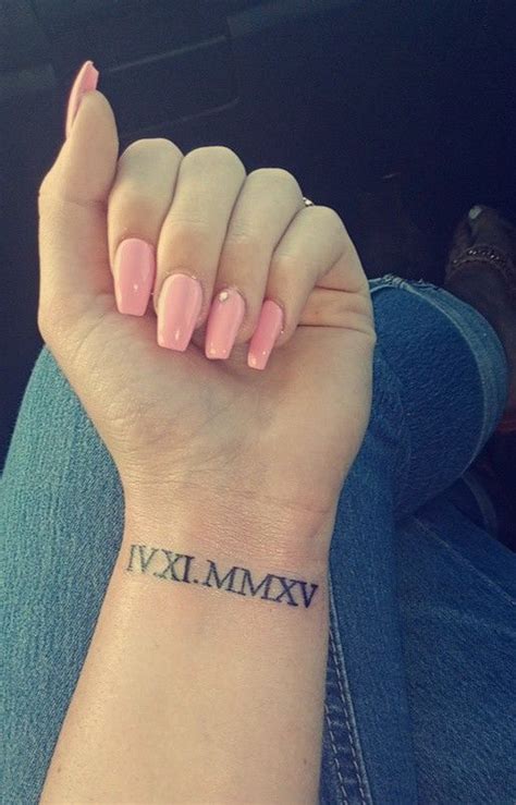 Chic Roman Numerals Wrist Tattoo and Pink Coffin Nails