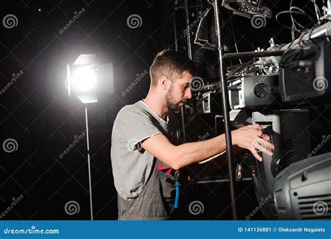 The Lighting Engineer Adjusts the Lights on the Stage. Stock Image - Image of desk, engineer ...