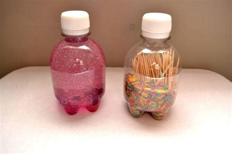 Two more sensory bottles: glitter and beads and toothpicks and colored rices which sounds a ...