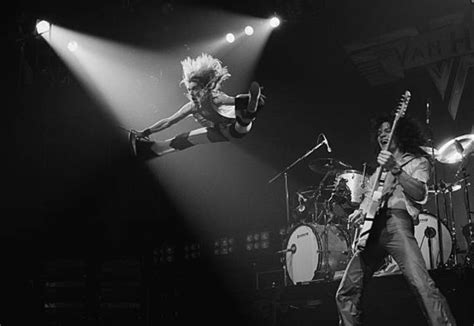 David Lee Roth Jumping in the air alongside Eddie Van Halen in 1978. Photo by Fin Costello. : r ...