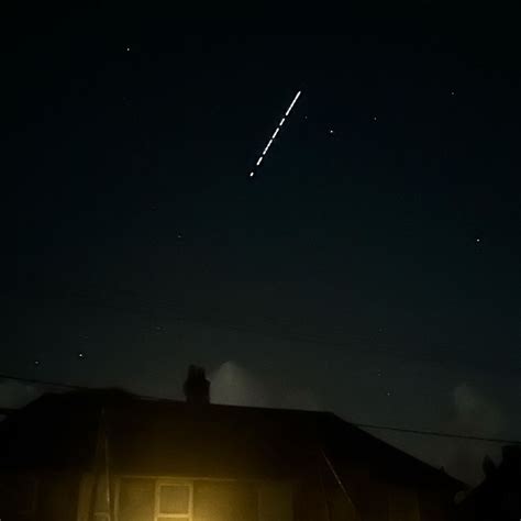 Elon Musk's Starlink satellites light up sky in south of England - BBC News