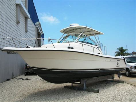 Pursuit boats for sale, boat makes noise when turning, wooden tv stands