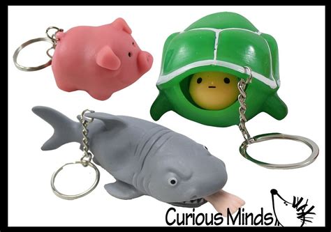 Set of 3 Fun Pop-Out Fidget Keychain Toys - Pooping Pig, Shark Attack ...