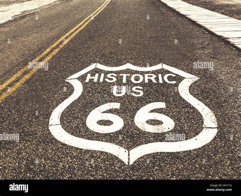 Historic US Route 66 highway sign on asphalt in Oatman, Arizona, United States. The picture was ...