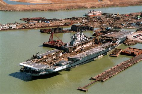 USS SARATOGA (CV-60), flight deck partially removed, being scraped in a dry dock at the Sparrows ...