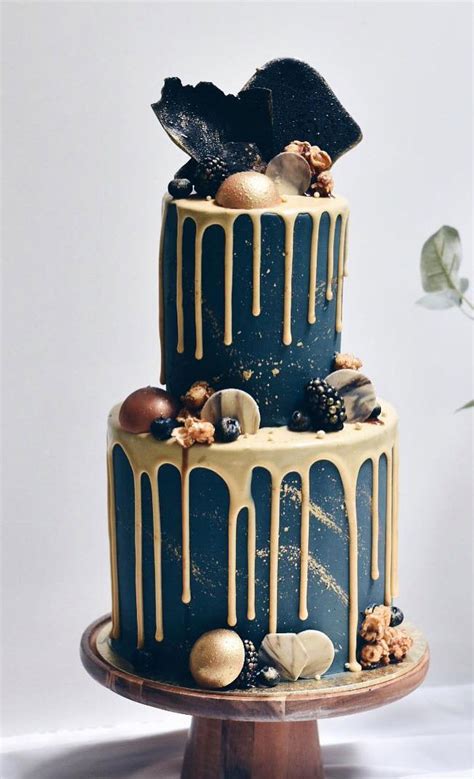 Gold drip wedding cake with chocolate and sweet topped